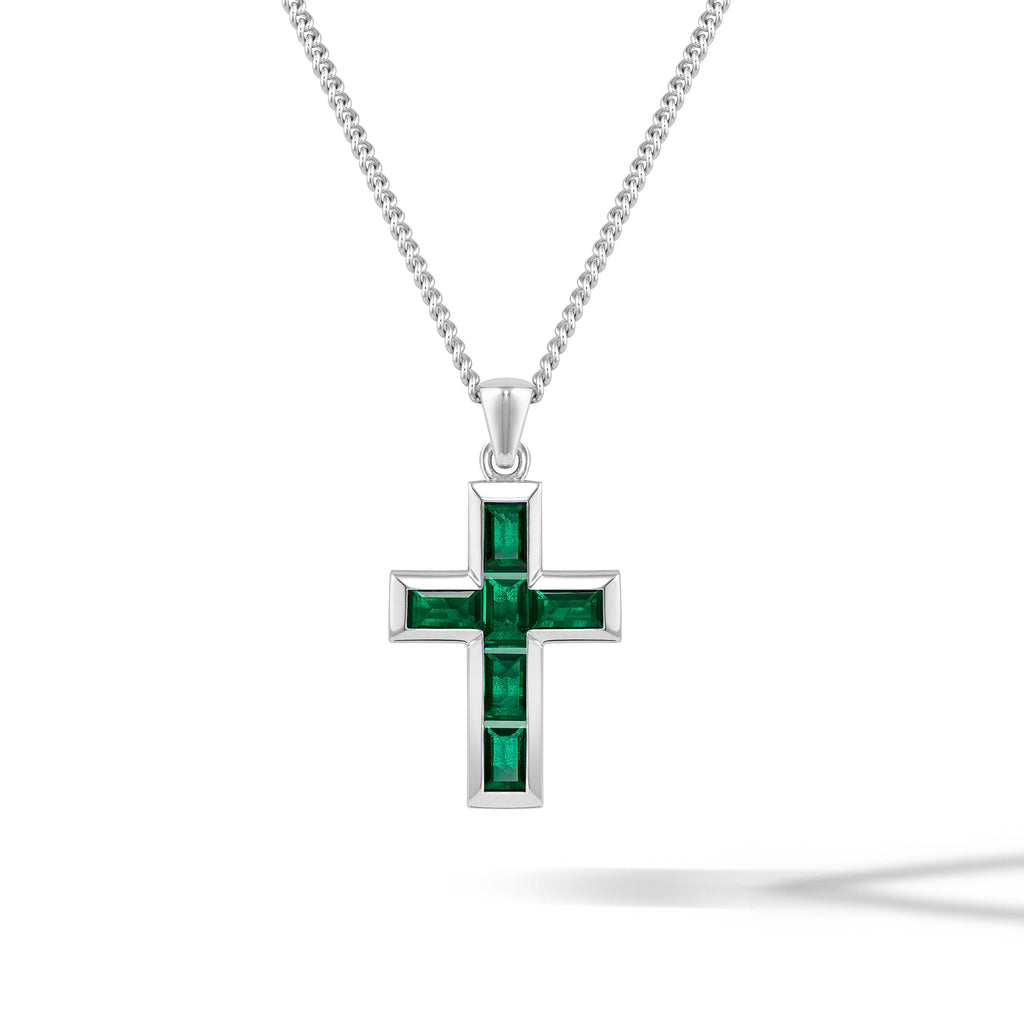 Minimalist cross pendant featuring a gemstone emerald inlay in 925 sterling silver