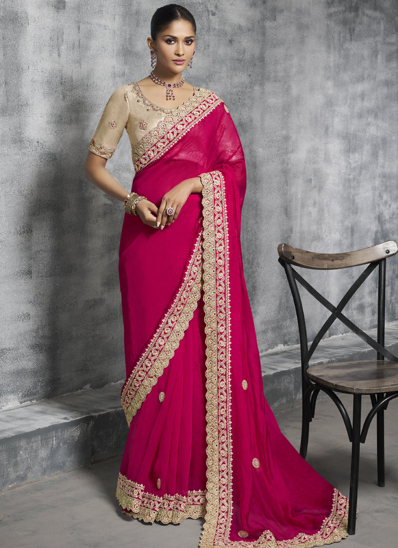 Red silk saree with heavy, elegant embroidery work