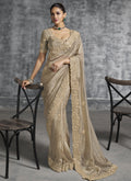 Beige art silk wedding saree with heavy embroidery detail