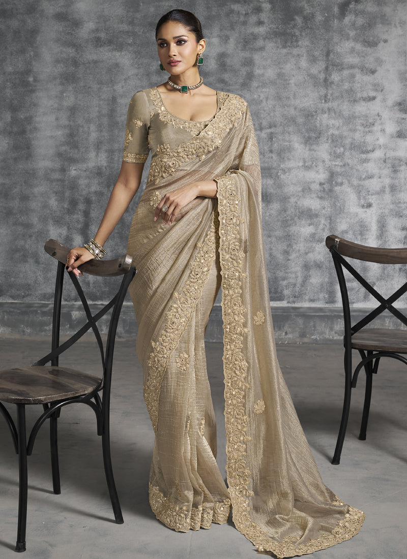 Beige art silk wedding saree with heavy embroidery detail