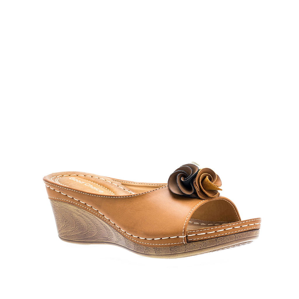 A pair of women's Sydney Tan wedge sandals with a floral embellishment and wood-look wedge heel