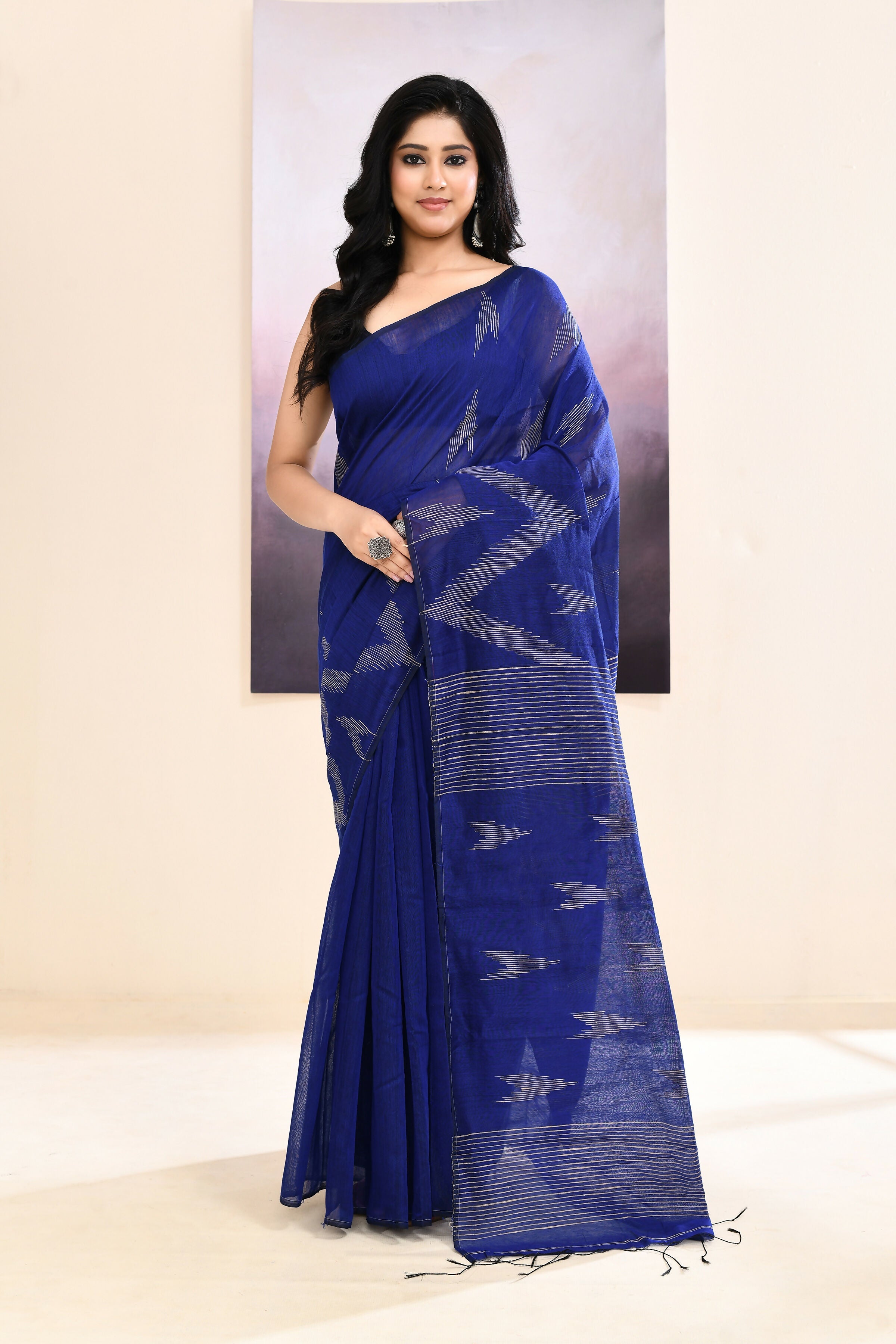 Blue embellished cotton blend Jamdani saree with traditional patterns