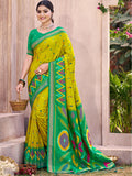 Light Green Pochampally Silk Saree with intricate patterns and matching blouse piece.