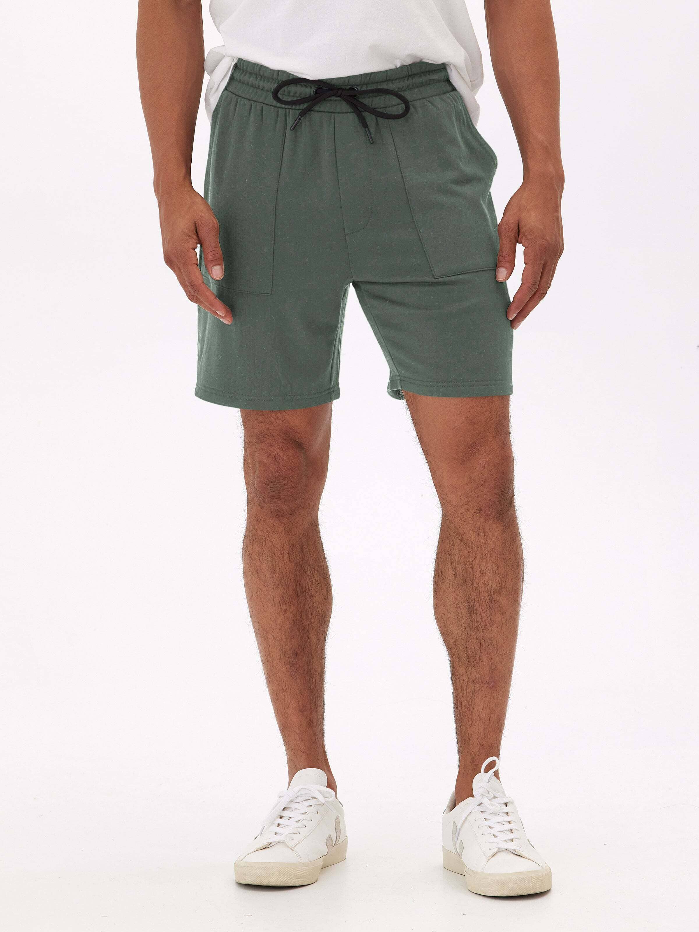 Men wearing comfortable Threads 4 Thought Core Feather Fleece Shorts in a casual lifestyle setting
