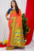 Vibrant orange Paithani silk saree with contrast blue blouse and zari woven detail