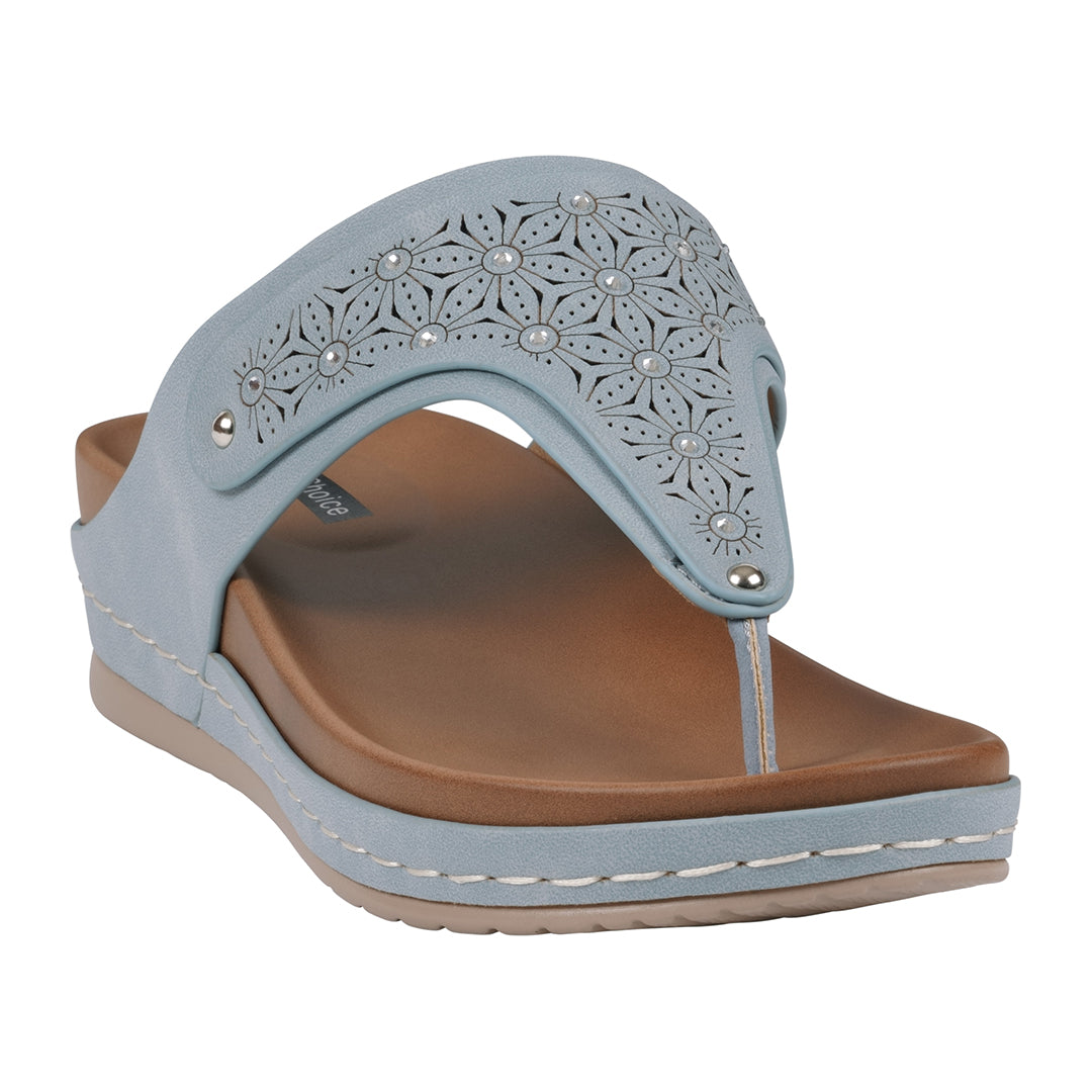 A pair of Royal Blue thong wedge sandals featuring a laser-cut floral design and a cushioned brown footbed.