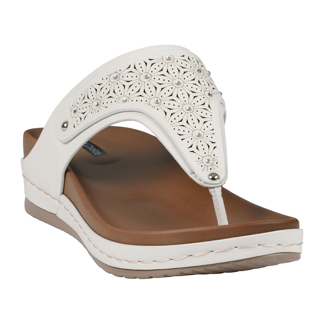 A pair of white women's thong wedge sandals featuring a laser-cut floral pattern on the strap and a comfortable brown footbed.