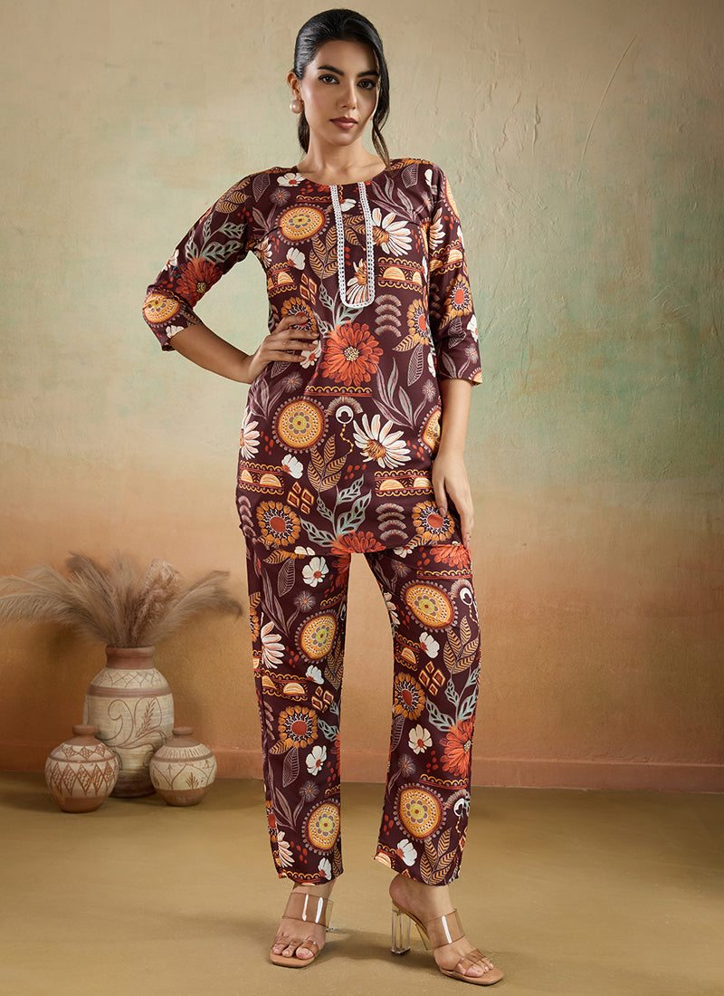 Woman wearing a brown printed cotton rayon co-ord set with matching pants for a festive look.