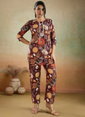 Woman wearing a brown printed cotton rayon co-ord set with matching pants for a festive look.