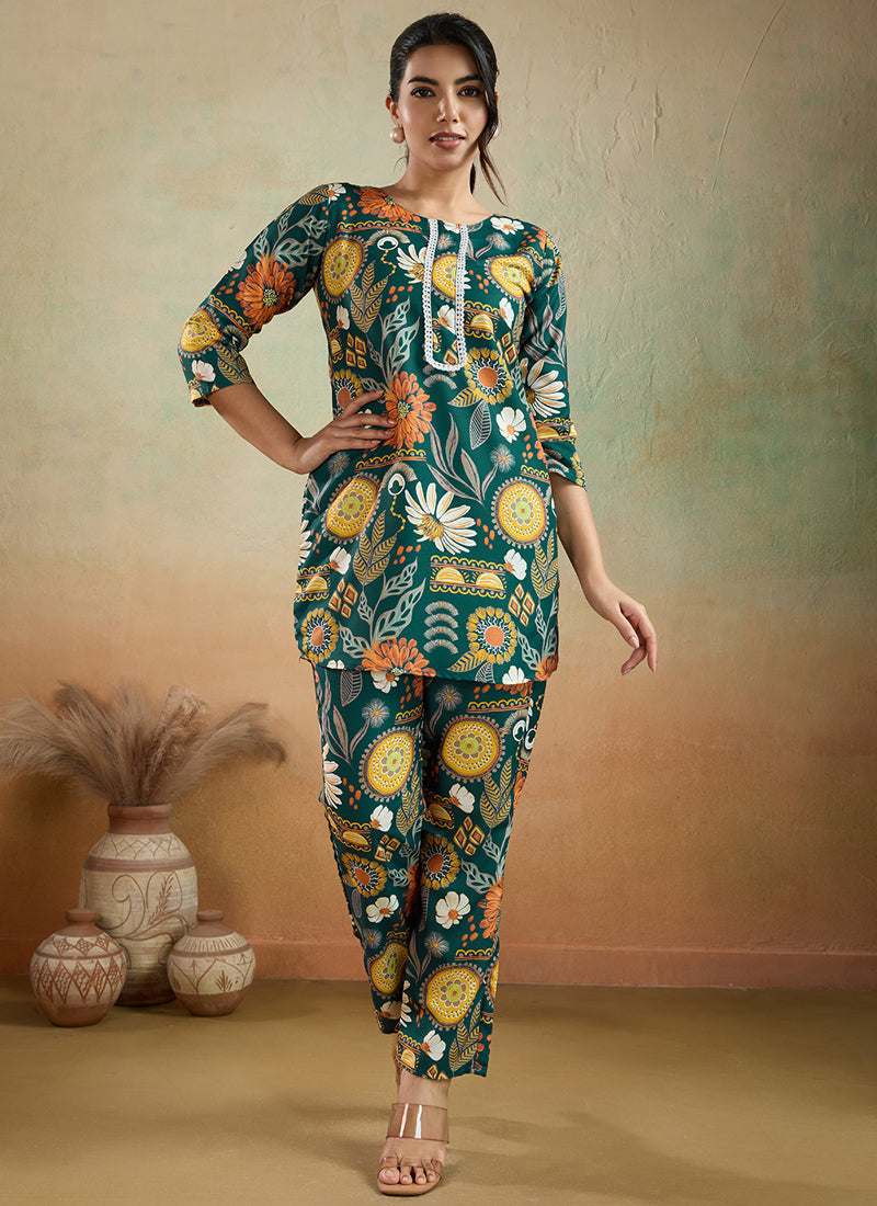 Woman wearing a green printed cotton rayon co-ord set with matching pants for festive or office wear.