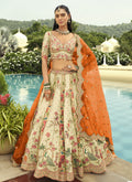 Elegant Off White silk lehenga choli with intricate embroidery and mirror work for wedding festivities