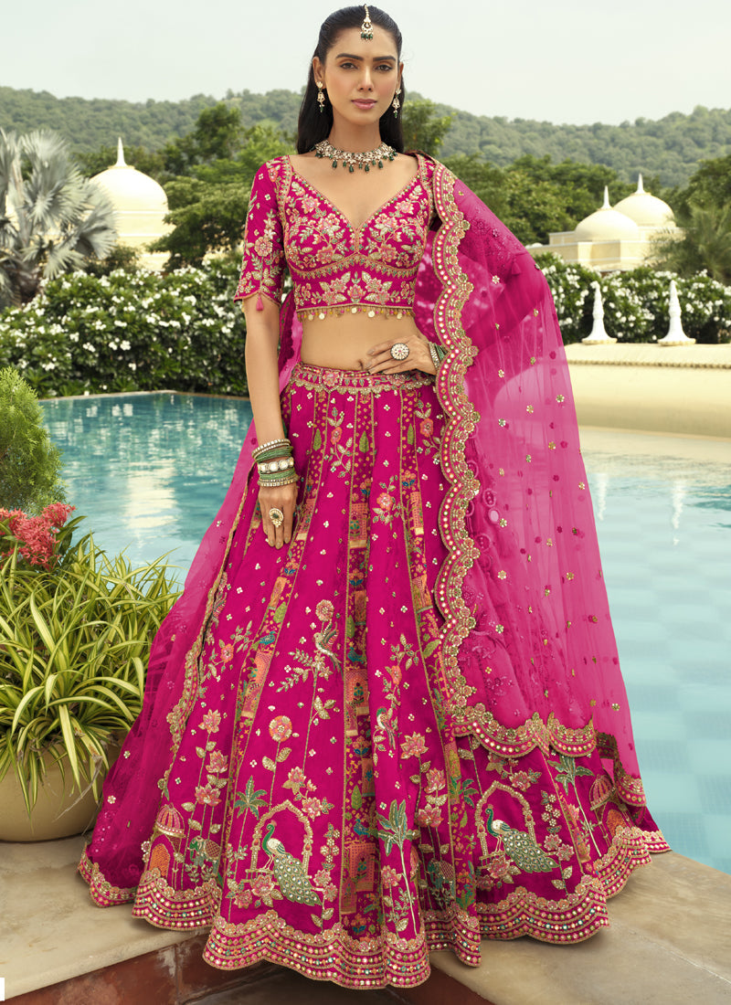 Rani Pink silk lehenga choli with intricate embroidery and art mirror work for wedding wear