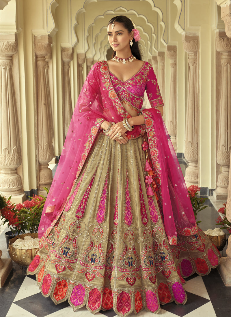 Beige silk lehenga choli with heavy embroidery and art mirror work details