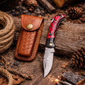 Damascus steel trailing point knife with red and black Pakkawood handle and leather sheath