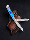 Zellige Tile double-blade folding knife with turquoise mosaic resin handle and leather belt sheath