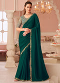 A beautiful green georgette saree featuring intricate embroidery, styled with an unstitched blouse piece.