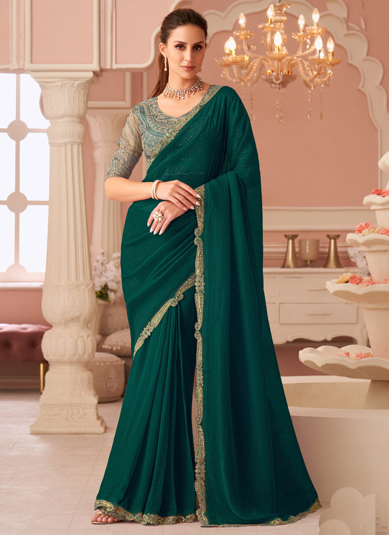 A beautiful green georgette saree featuring intricate embroidery, styled with an unstitched blouse piece.