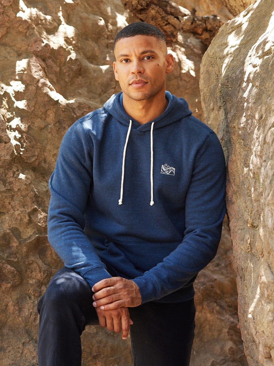 Close up of Embroidered Triblend Fleece Hoodie showing soft brushed-back fabric texture and embroidery detail.