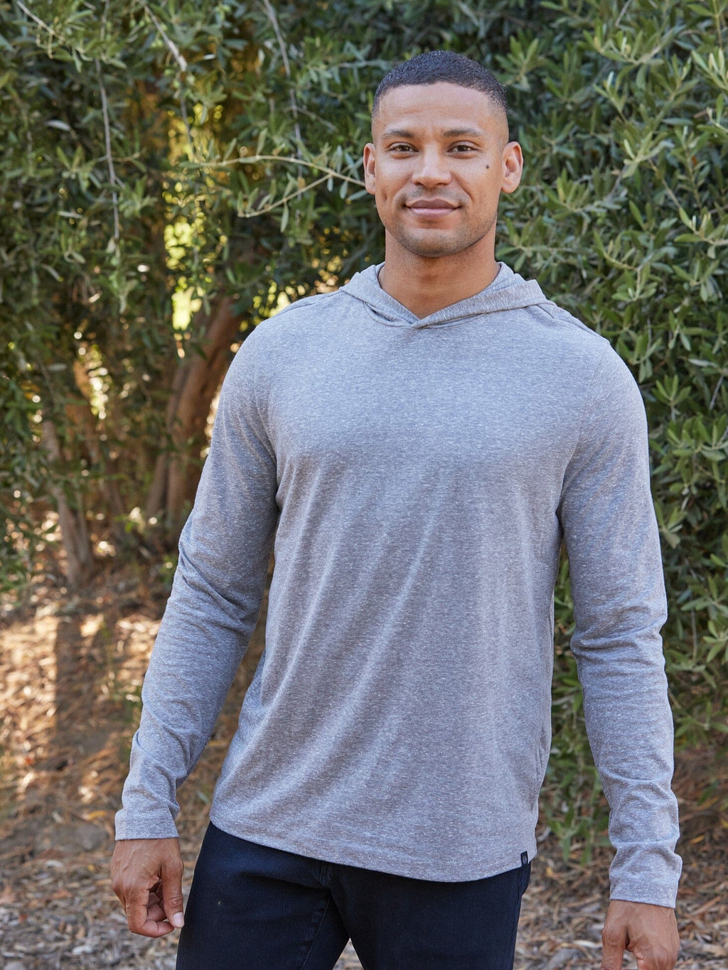 Grey men's long sleeve hooded t-shirt made from eco-triblend jersey