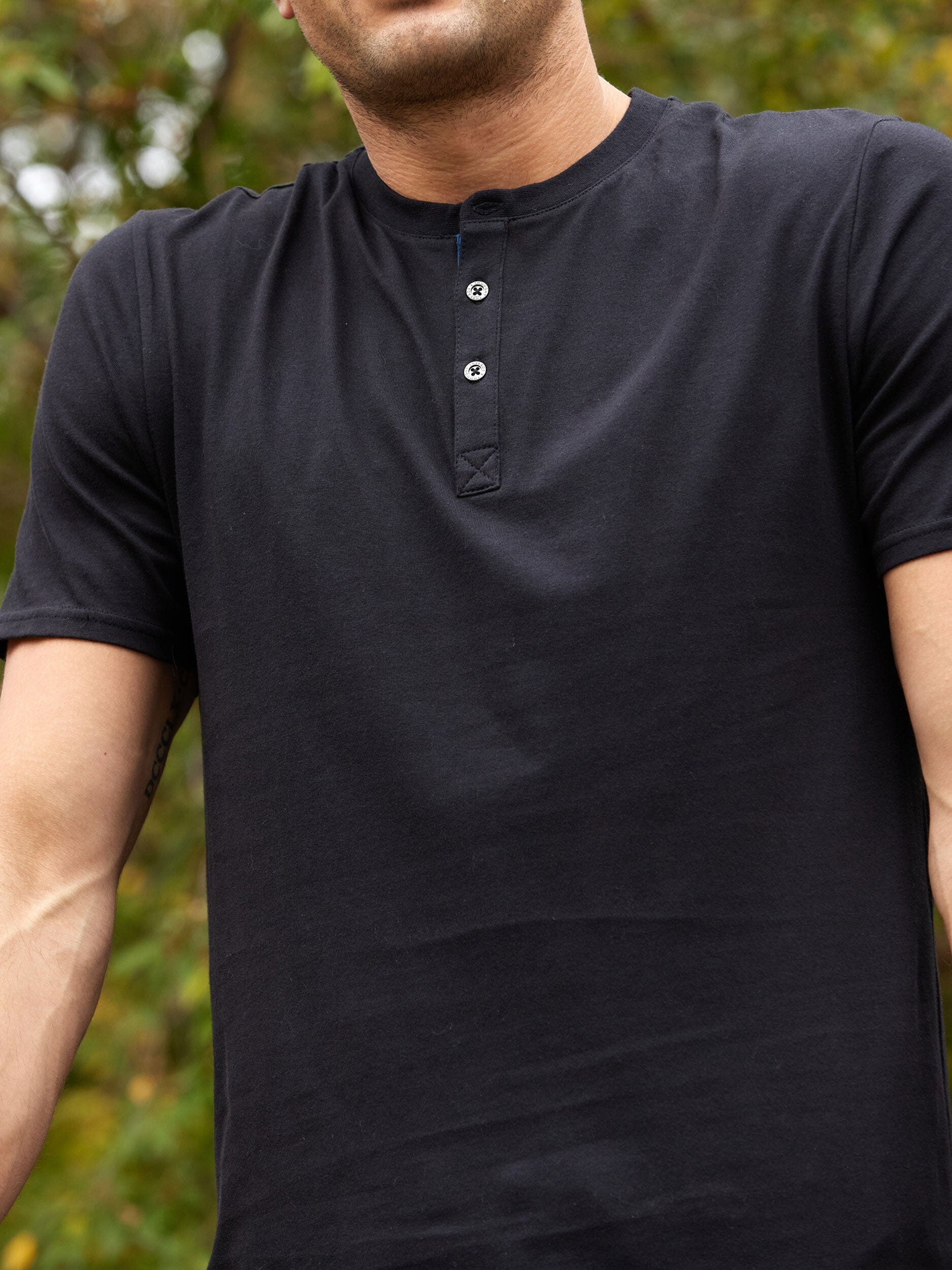 Close up of Chester Organic Cotton Henley featuring a contrast placket detail.