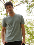 A man wearing a grey Core Triblend V-Neck tee with an athletic fit