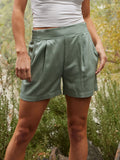 Zofia Airy Woven Short 3-inch in muted sage green, featuring a high-rise elastic waistband and relaxed silhouette.