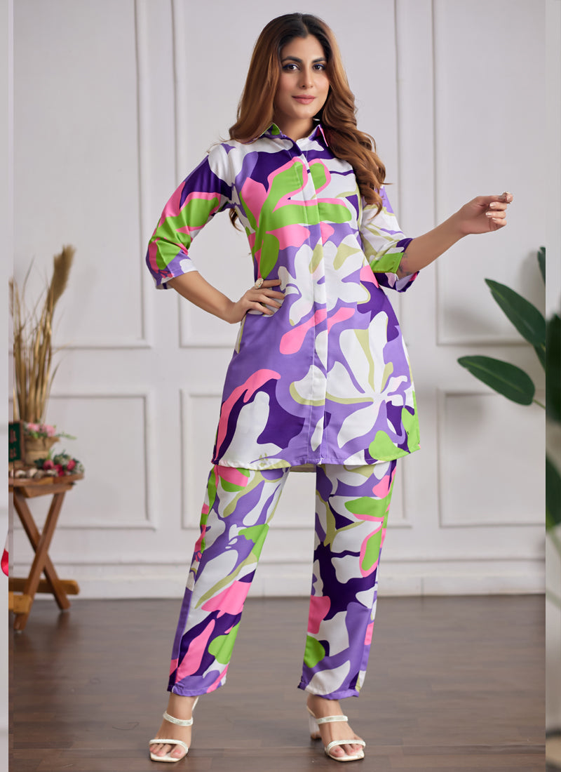 Woman wearing a stylish multi-color printed cotton-rayon co-ord set with matching pants for festive occasions.