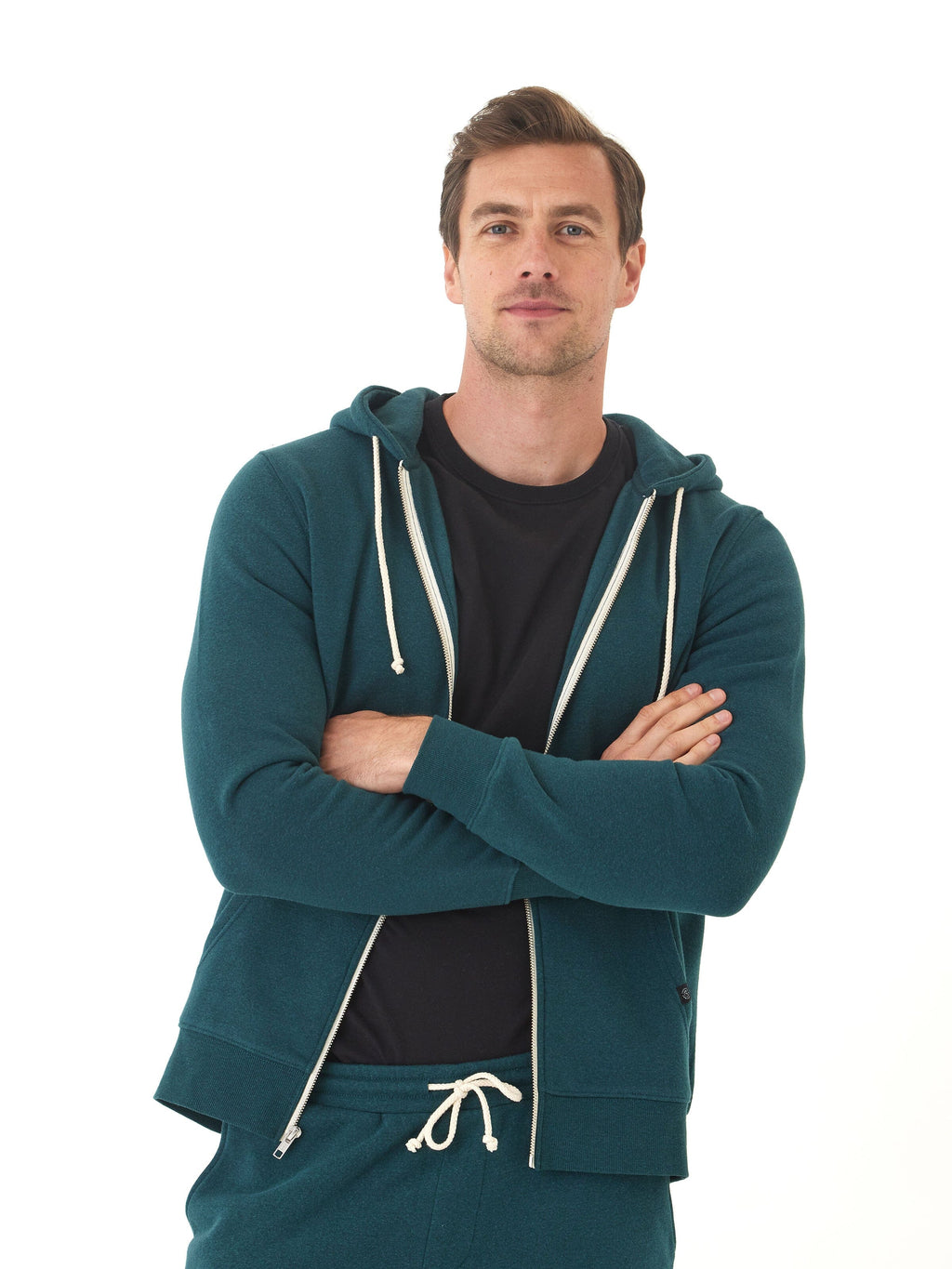 Men's core triblend fleece zip hoodie in deep teal with off-white drawstring accents and a full zip front.
