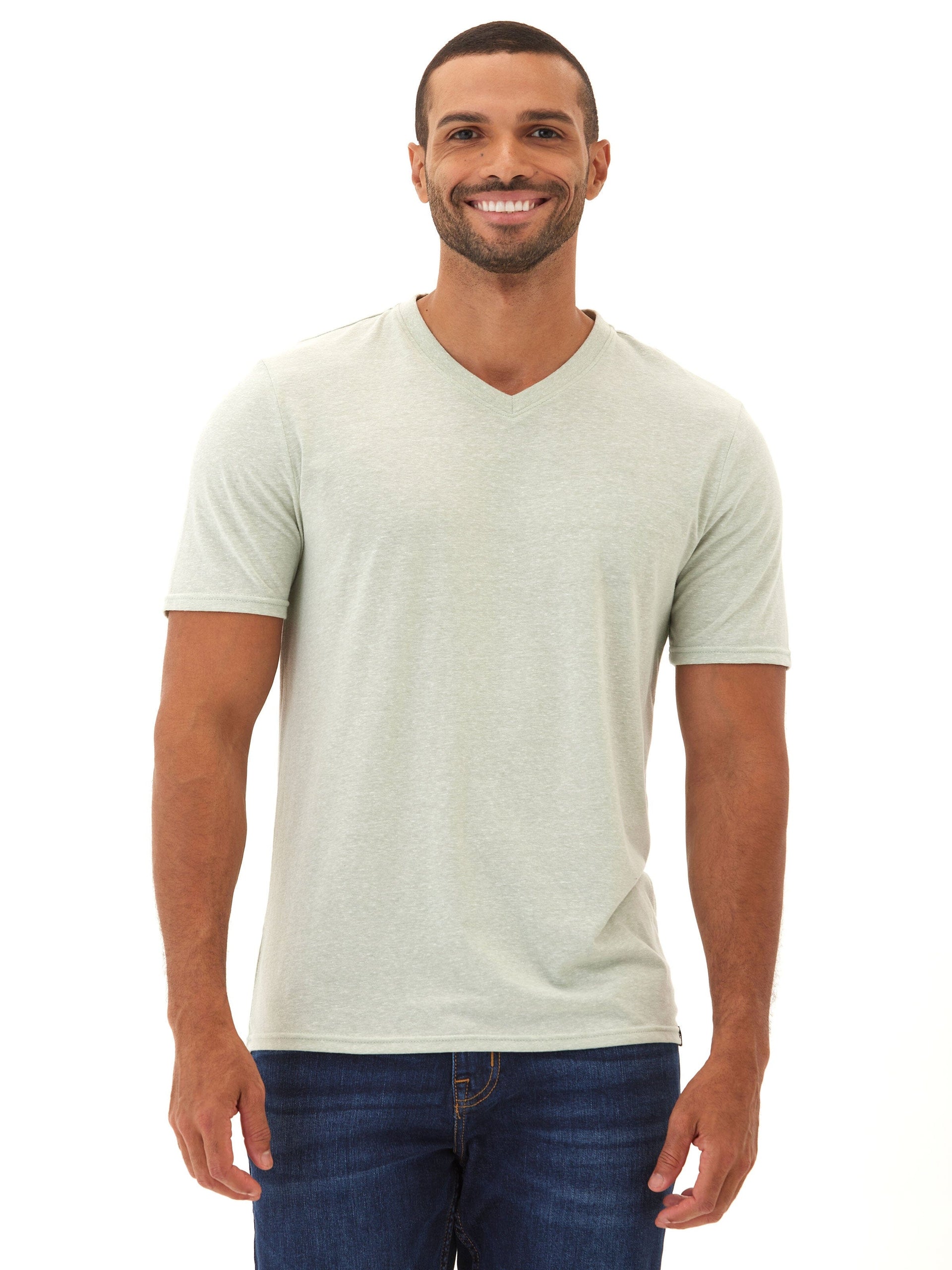 Men wearing a solid light green V-neck triblend jersey t-shirt with a minimalist aesthetic.