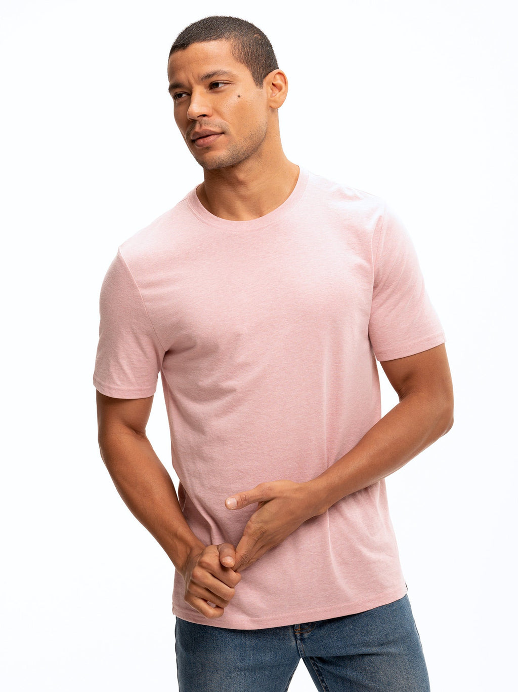 Men wearing a solid minimalist pink crew neck triblend jersey t-shirt