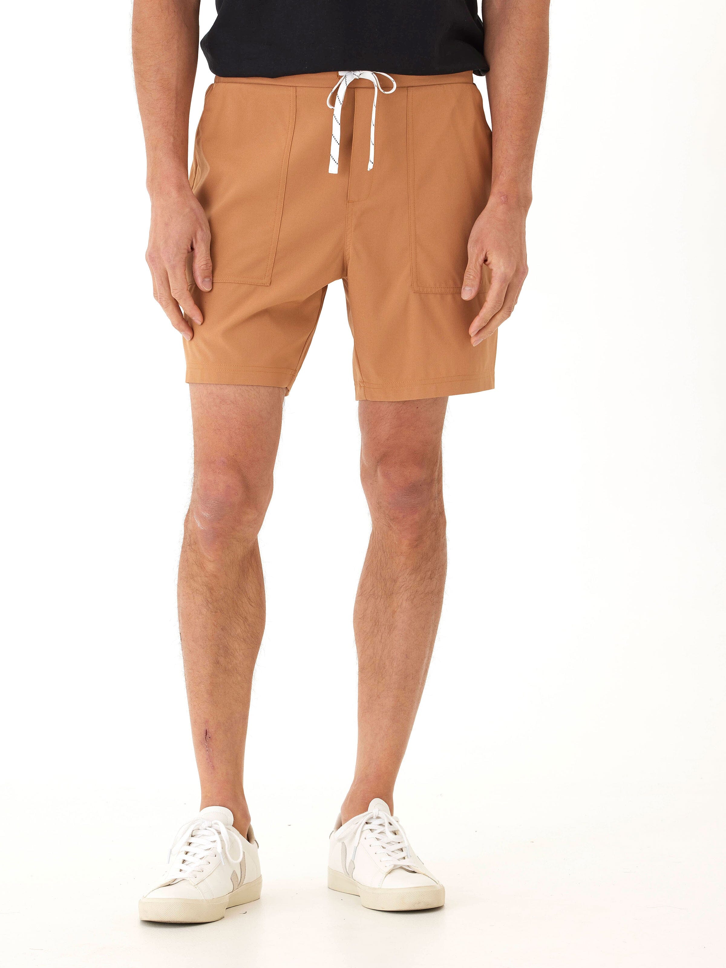Men's Prescott Essential Eco Woven Short in a warm tan earth tone with a mid-rise, straight silhouette.