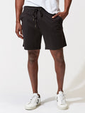 Men wearing black 6.5-inch knit athletic shorts with a solid, modern design