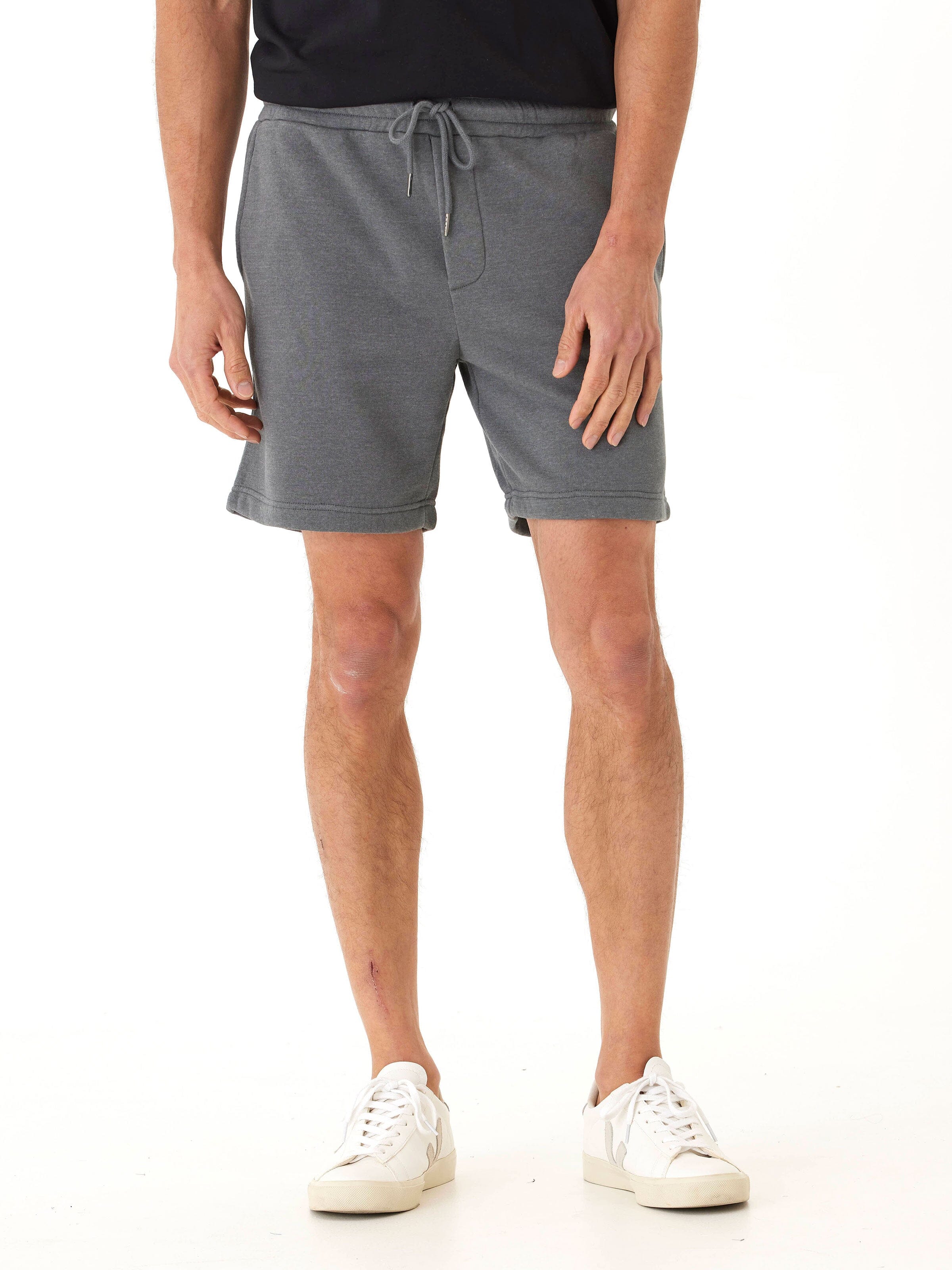 Men’s grey mineral wash fleece shorts in a solid knit fabric with a sporty, minimalist look.