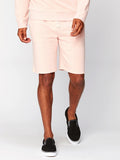 Garrett 9 inch knit shorts in a light heathered pastel pink for men, shown in a casual sporty style.
