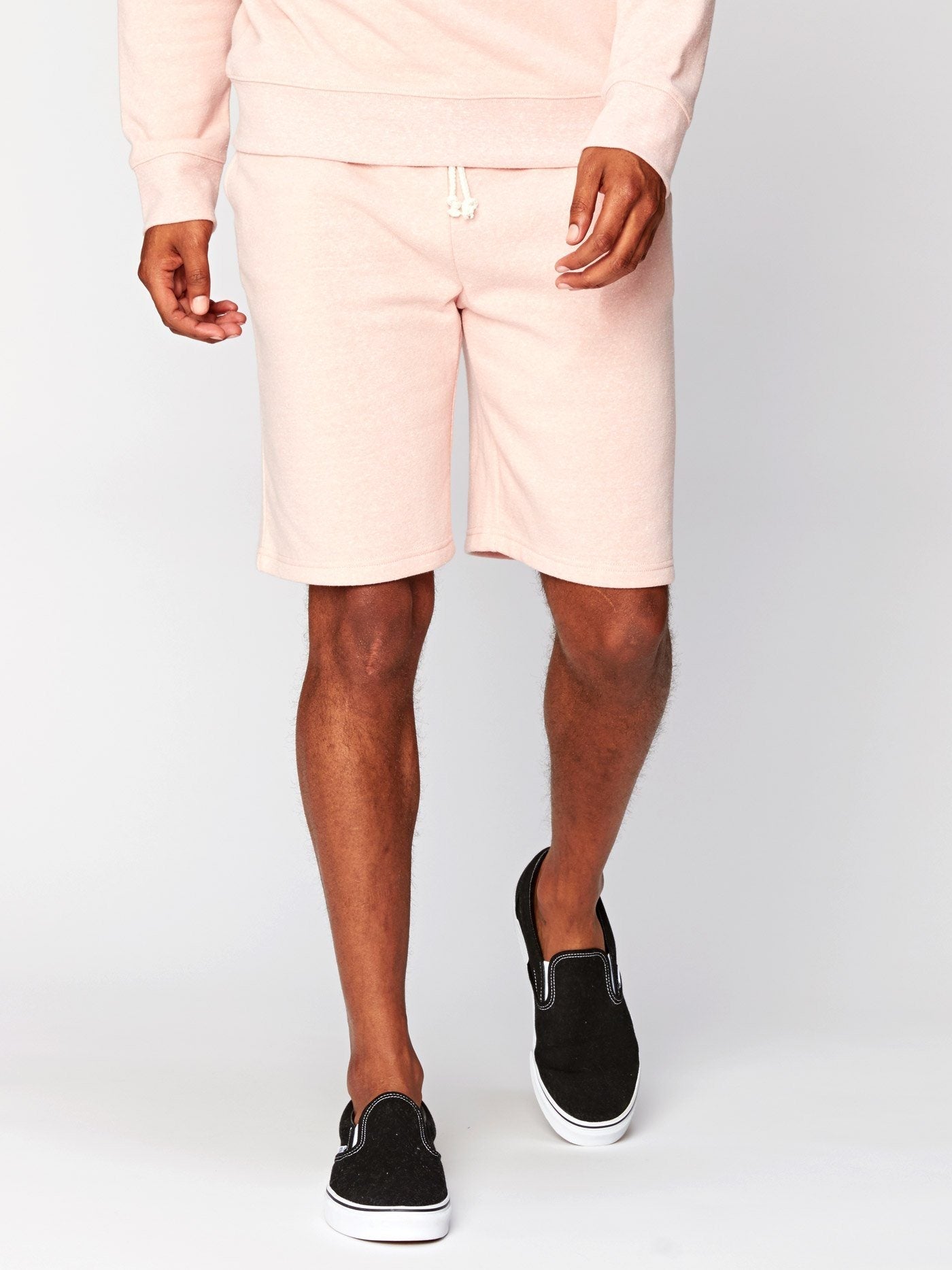 Garrett 9 inch knit shorts in a light heathered pastel pink for men, shown in a casual sporty style.