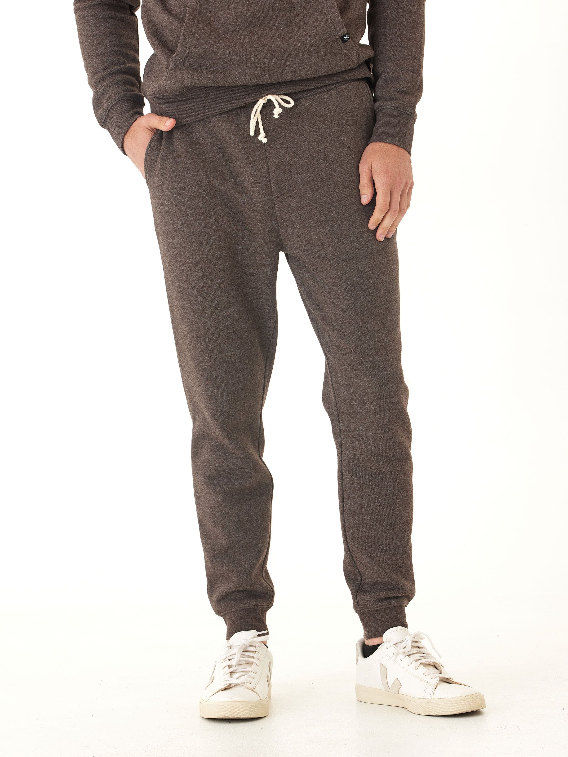 Men wearing dark espresso brown heather triblend fleece joggers in a minimalist athletic style
