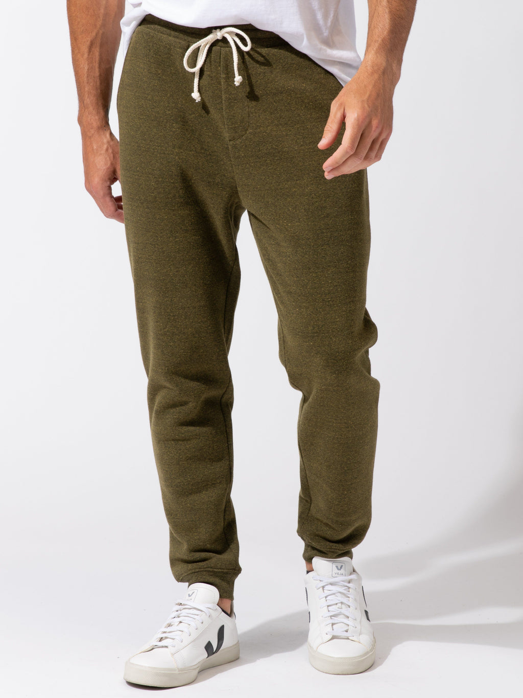 Men wearing olive green triblend fleece jogger with a relaxed, tapered fit.