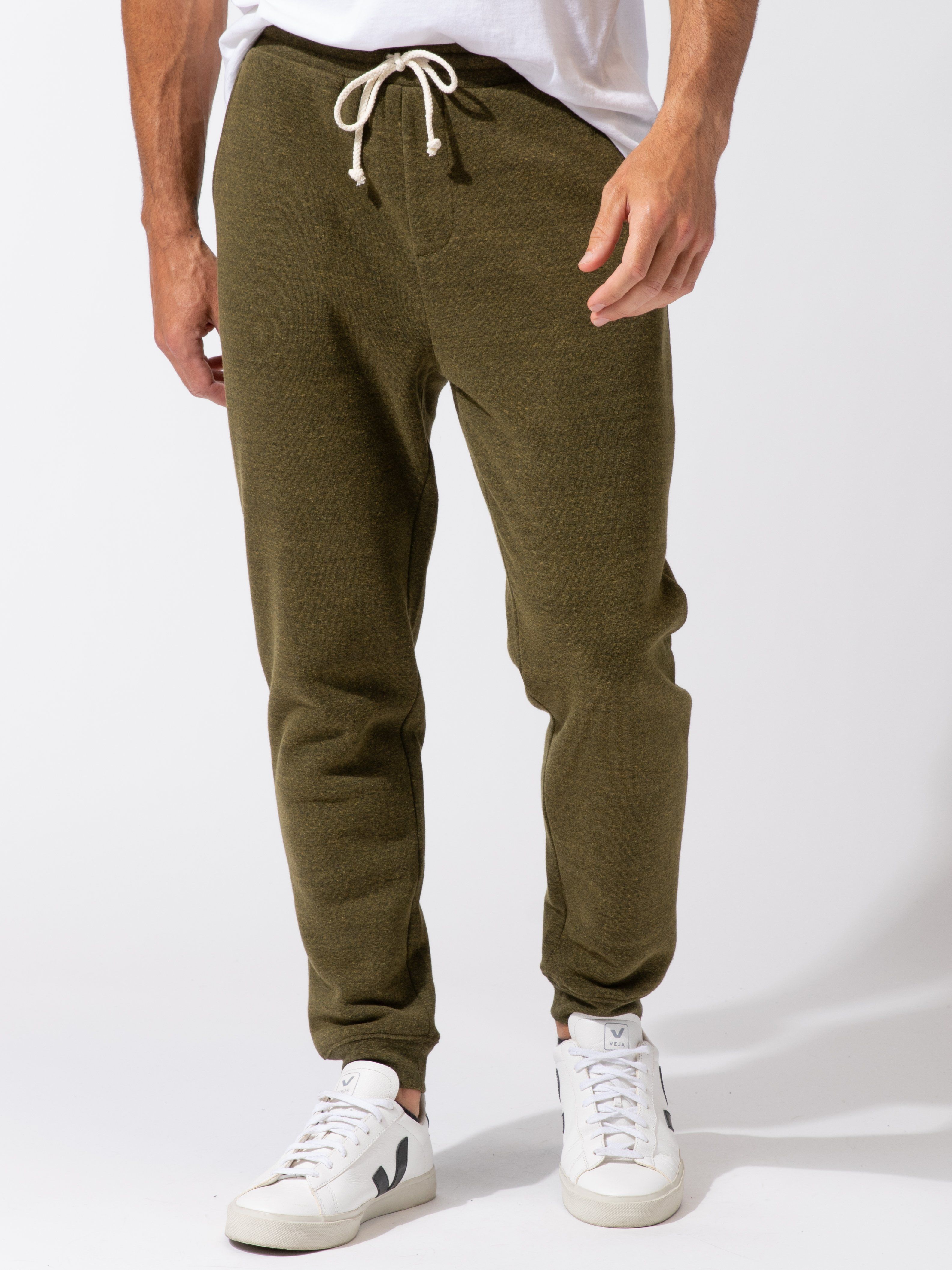 Men wearing olive green triblend fleece jogger with a relaxed, tapered fit.