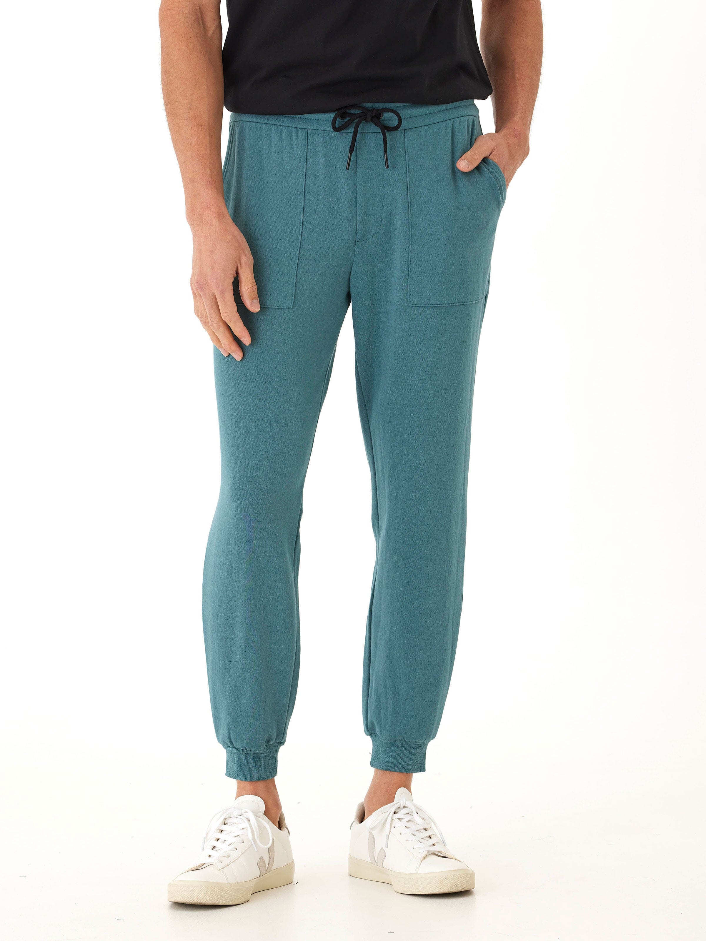 Close up of soft FeatherLoop fleece fabric on a pair of Men's Core Feather Fleece Joggers in a neutral tone