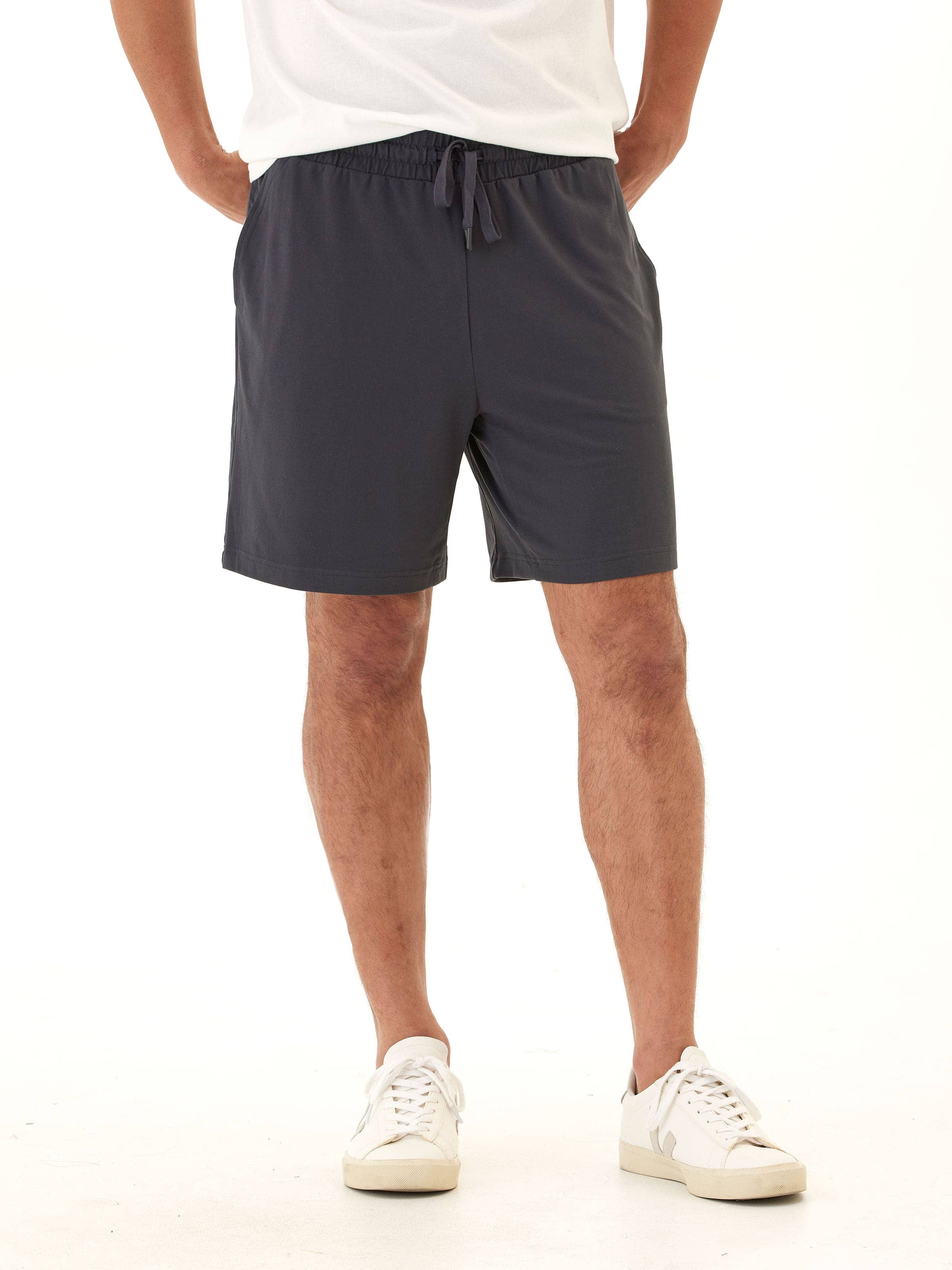 Men's charcoal grey knit mid-length shorts with an adjustable drawstring and clean minimalist design.