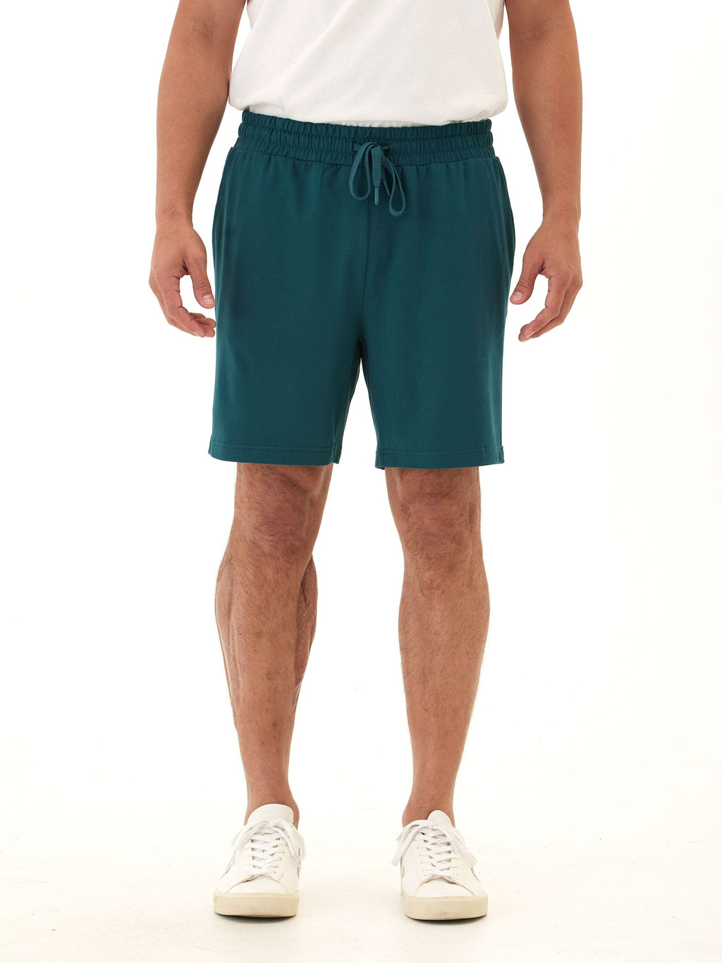 Men's teal dark green knit mid-length shorts featuring an adjustable drawcord and rear pocket tag branding.