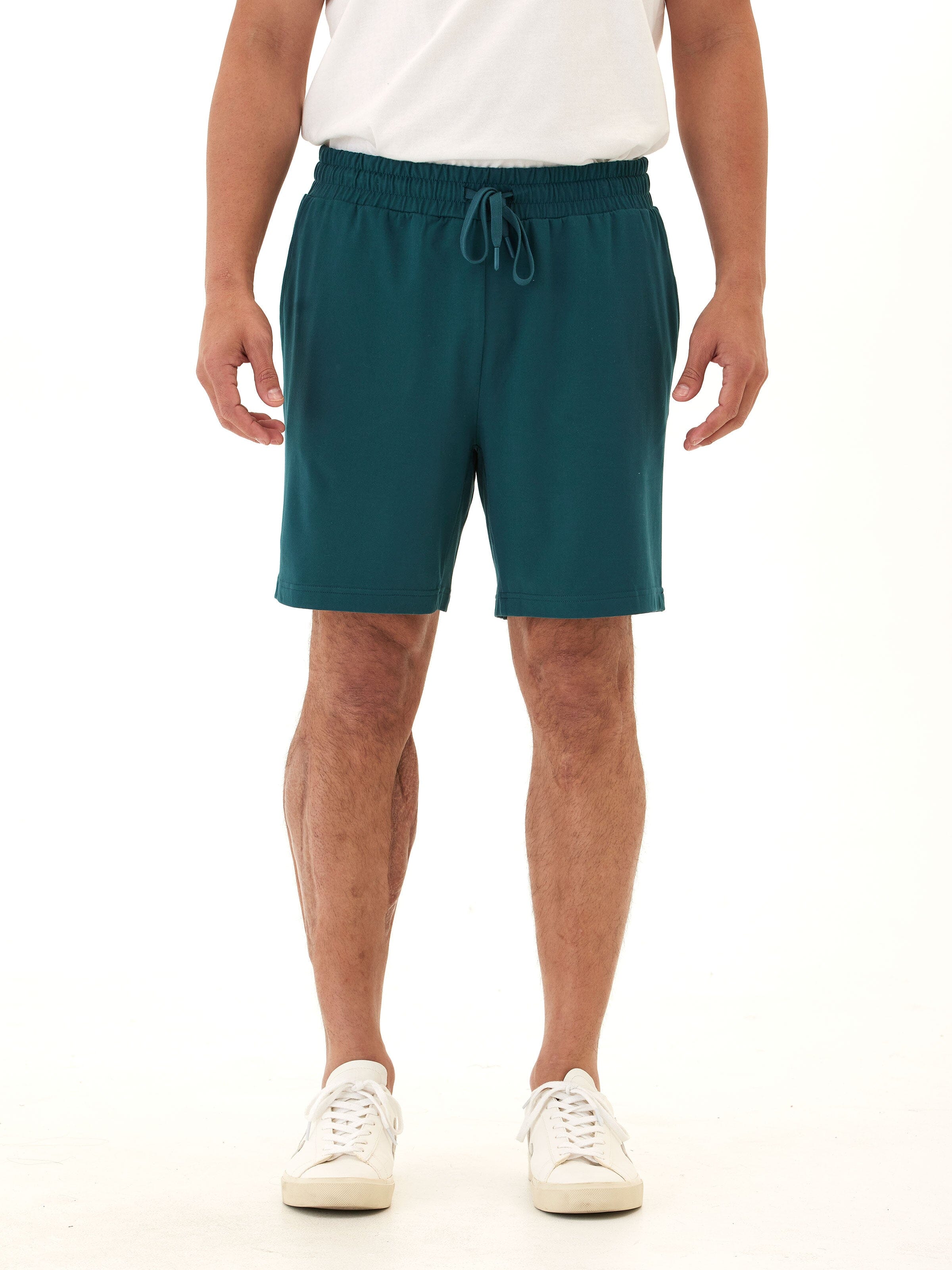 Men's teal dark green knit mid-length shorts featuring an adjustable drawcord and rear pocket tag branding.
