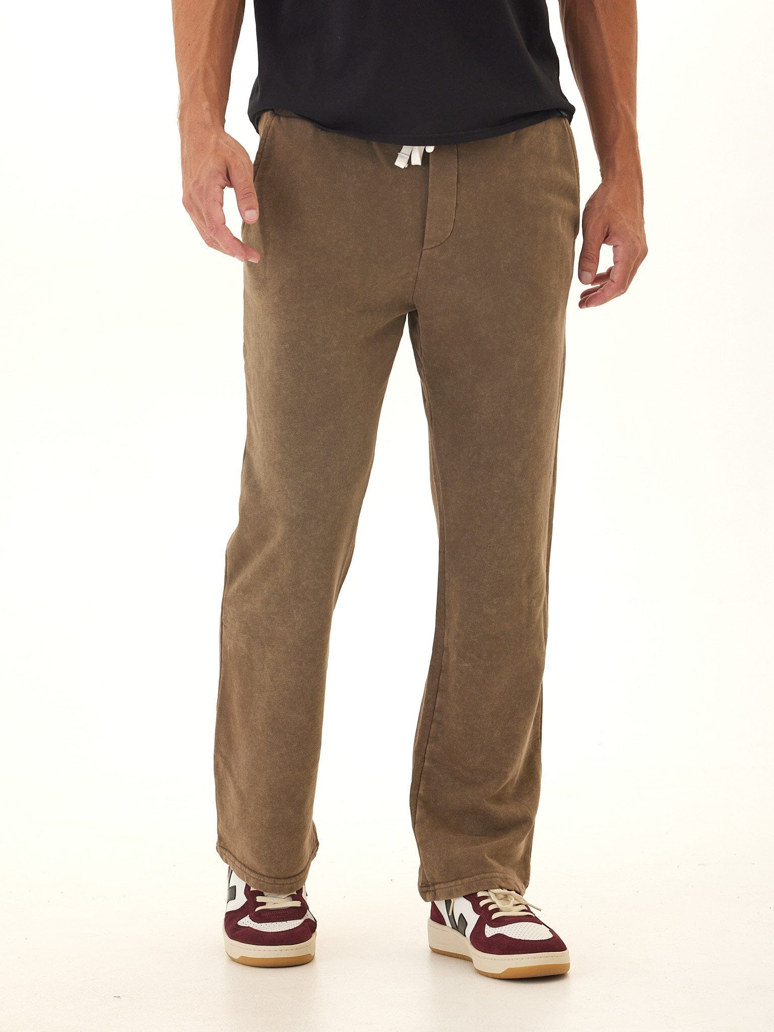 Men wearing brown mineral wash cotton blend straight-leg lounge pants with drawstring waist.