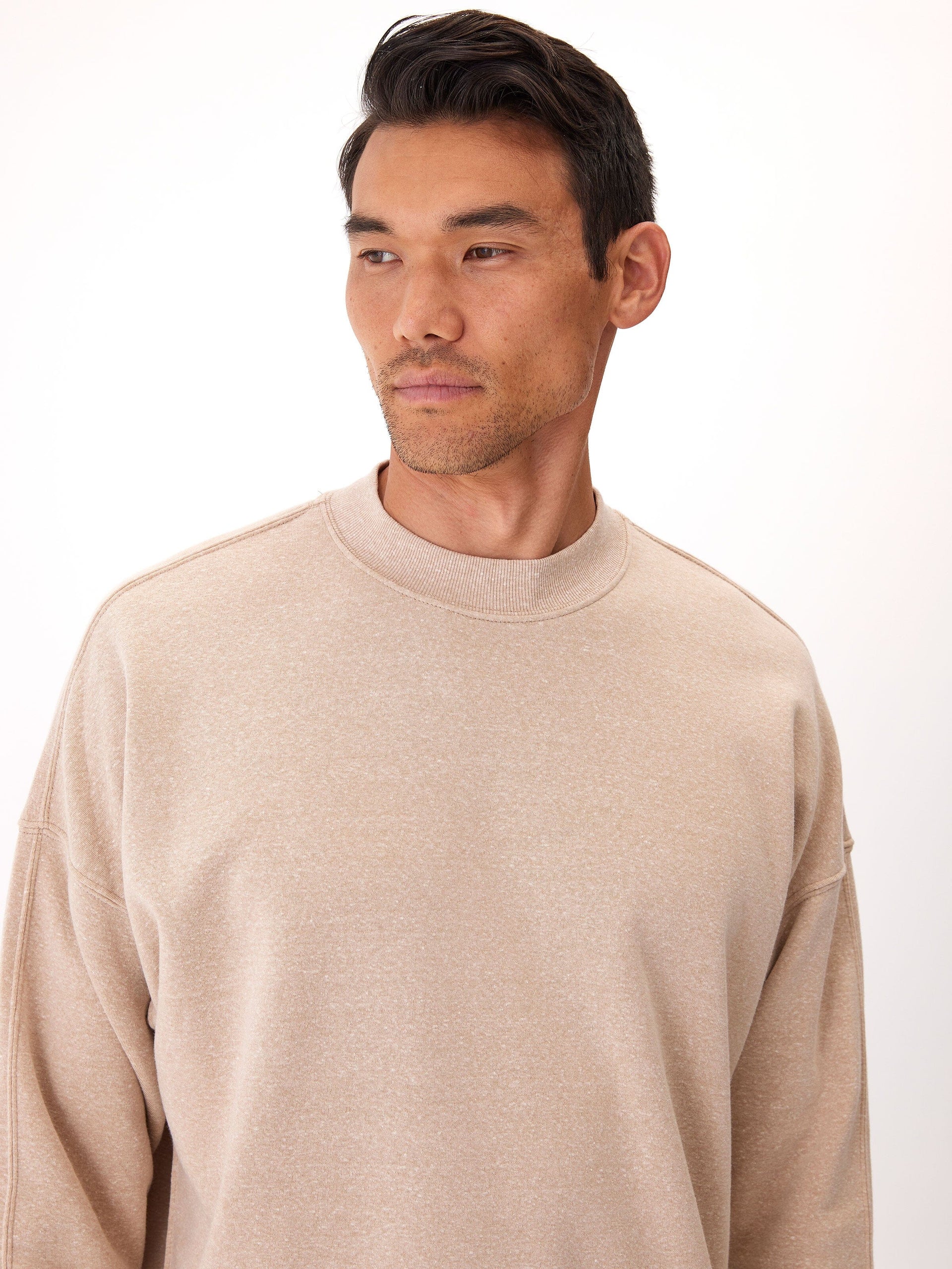 A comfortable Rudy Triblend Fleece Drop Shoulder Sweatshirt in a neutral tone, featuring a soft brushed-back fleece interior.
