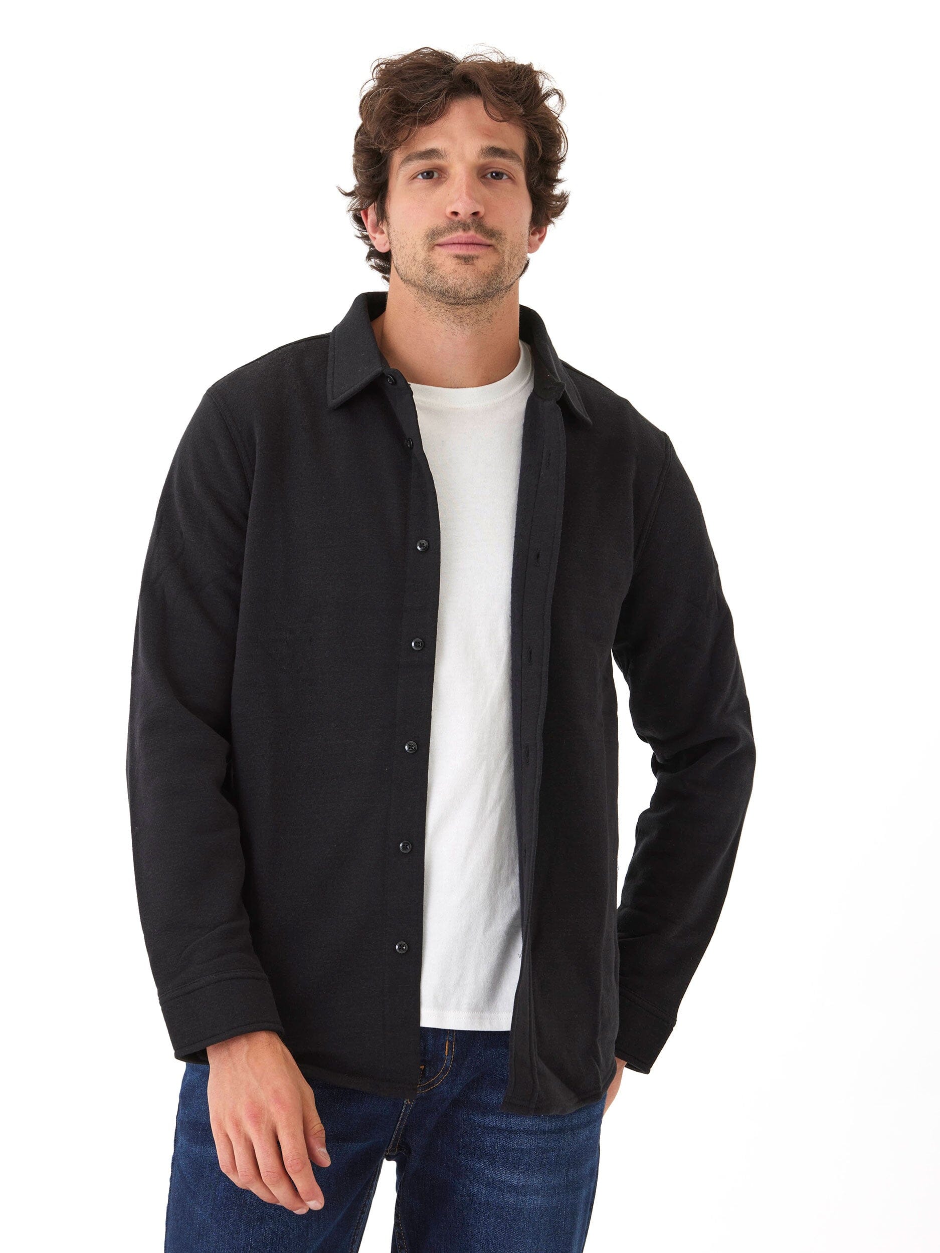 Men wearing a black Mika triblend fleece button down shirt with a collared neckline and long sleeves.