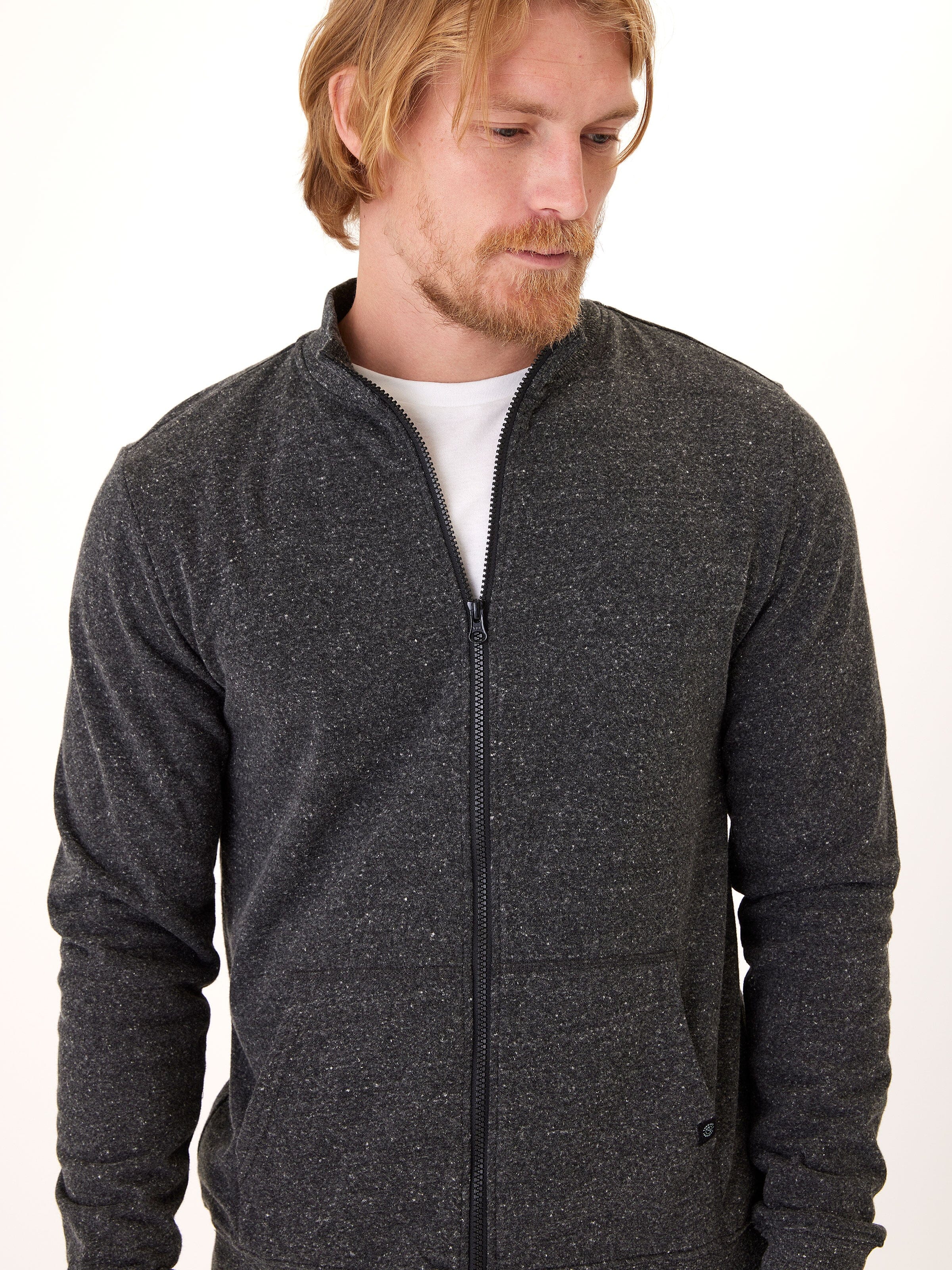 Men wearing a charcoal grey triblend fleece full zip jacket with a collared neckline and zip-fly closure.