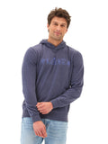Close up of a soft mineral wash hoodie featuring a clean graphic print and comfortable fleece texture.