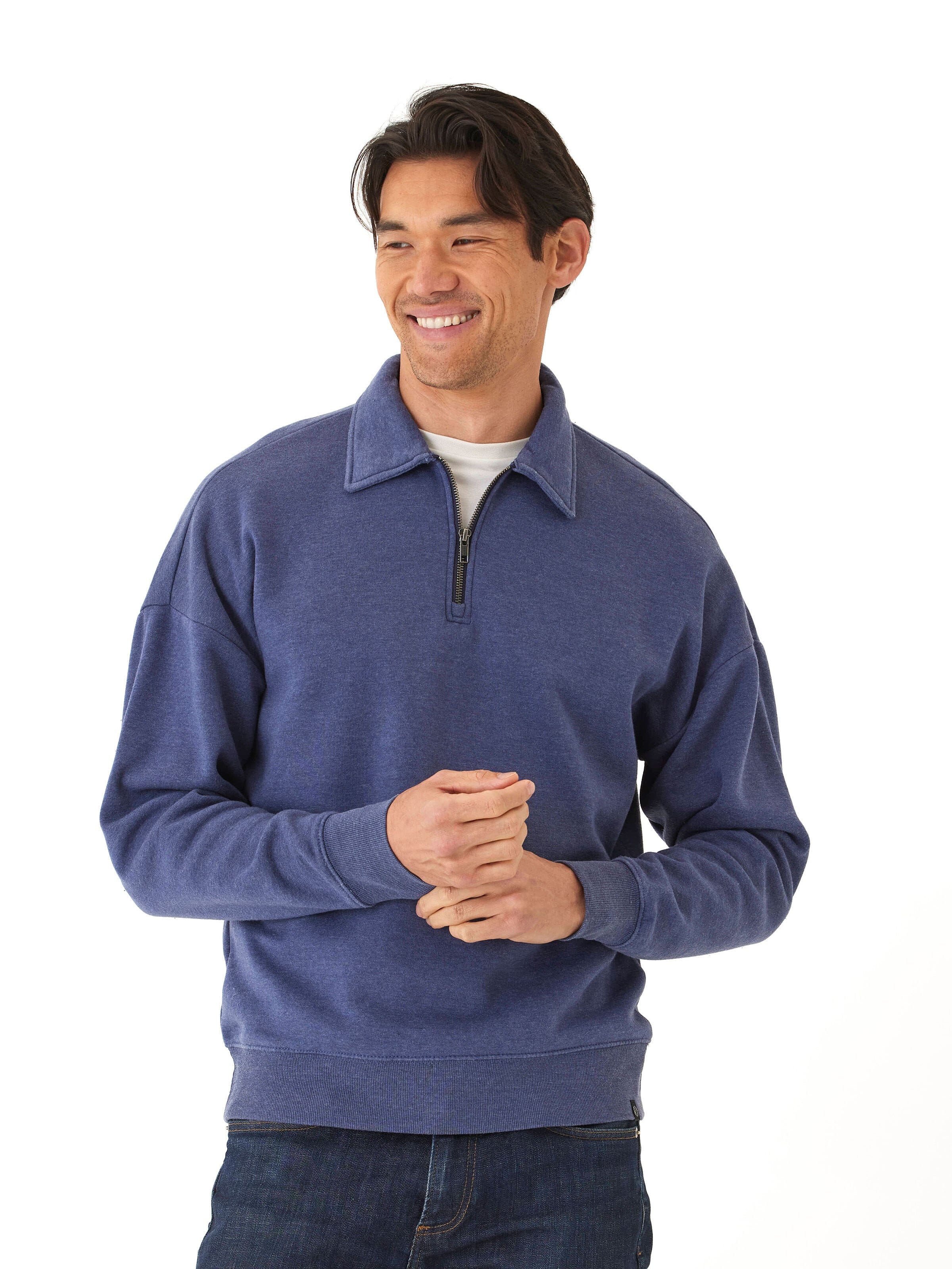 Men wearing a blue mineral wash fleece 1/4 zip pullover with ribbed cuffs