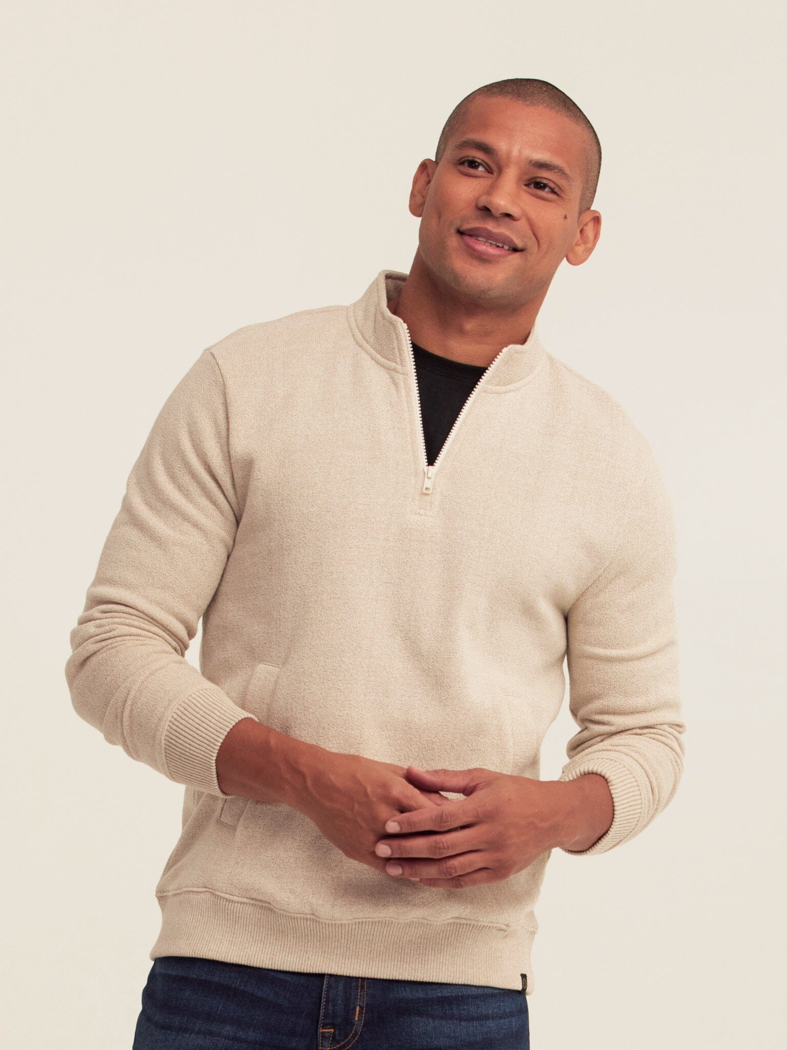Greg Eco Fleece Quarter Zip Pullover in a cozy, sustainable fleece fabric with a functional front pocket and ribbed hem.