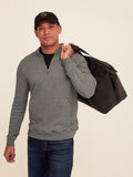 Men's grey quarter zip pullover featuring cozy fleece material, ribbed cuffs, and hem.